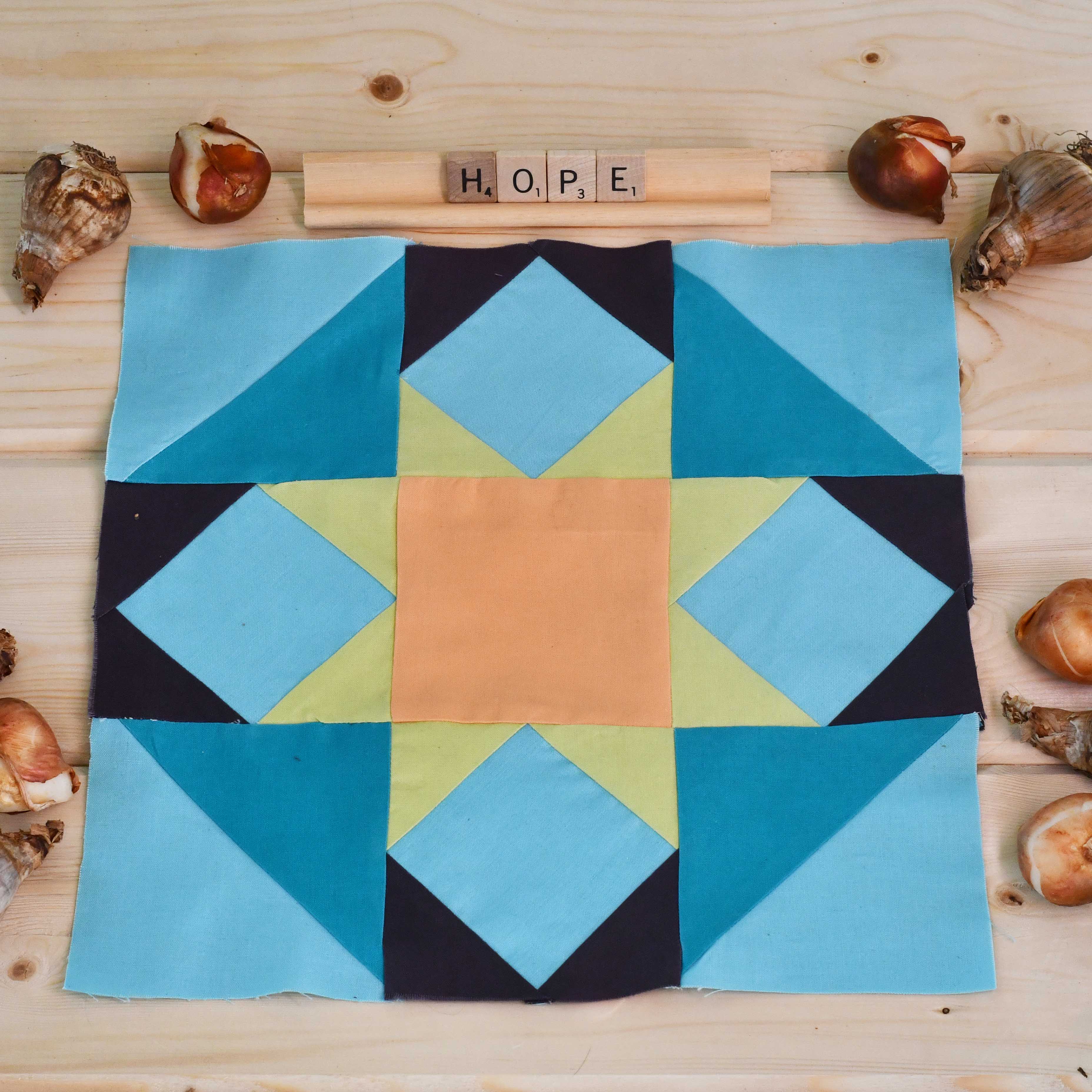 Feeling Hope? Hope Challenge Quilt Block from the Live Well Live Strong Quilt available exclusively at Stitches Quilting.